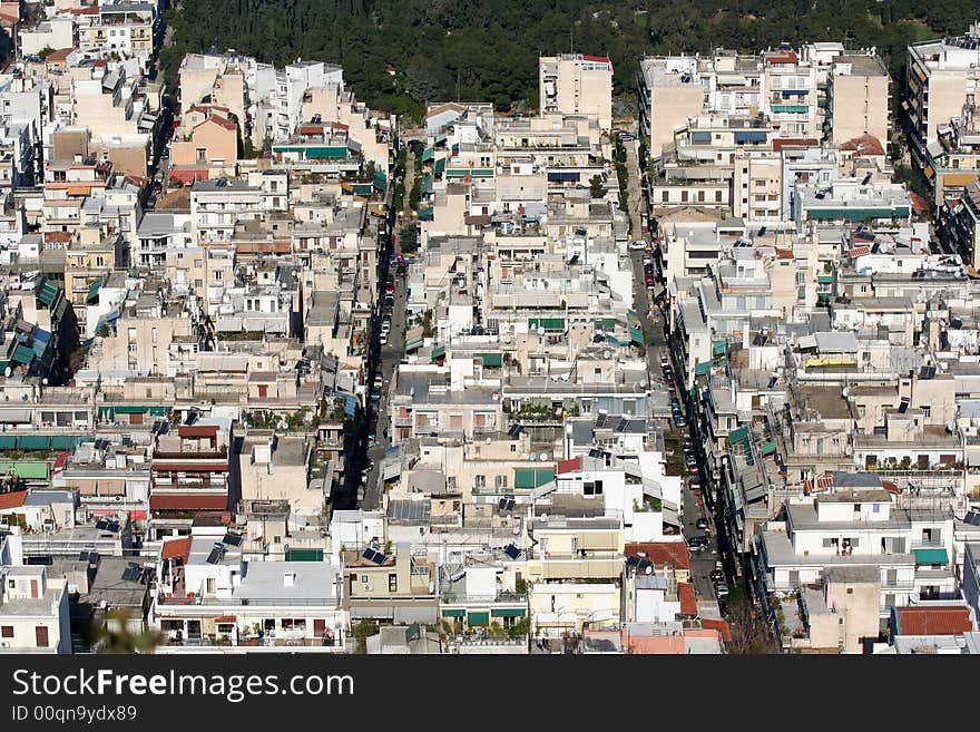 A view of a densely populated area of the city of Athens, Greece, from a hill top. A view of a densely populated area of the city of Athens, Greece, from a hill top