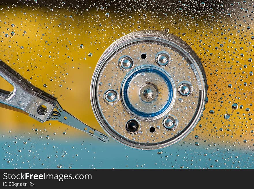 Macro shot of an hard disk with drops of water. Macro shot of an hard disk with drops of water