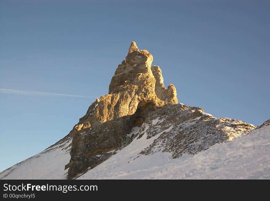 Cliff In Snowy Mountains