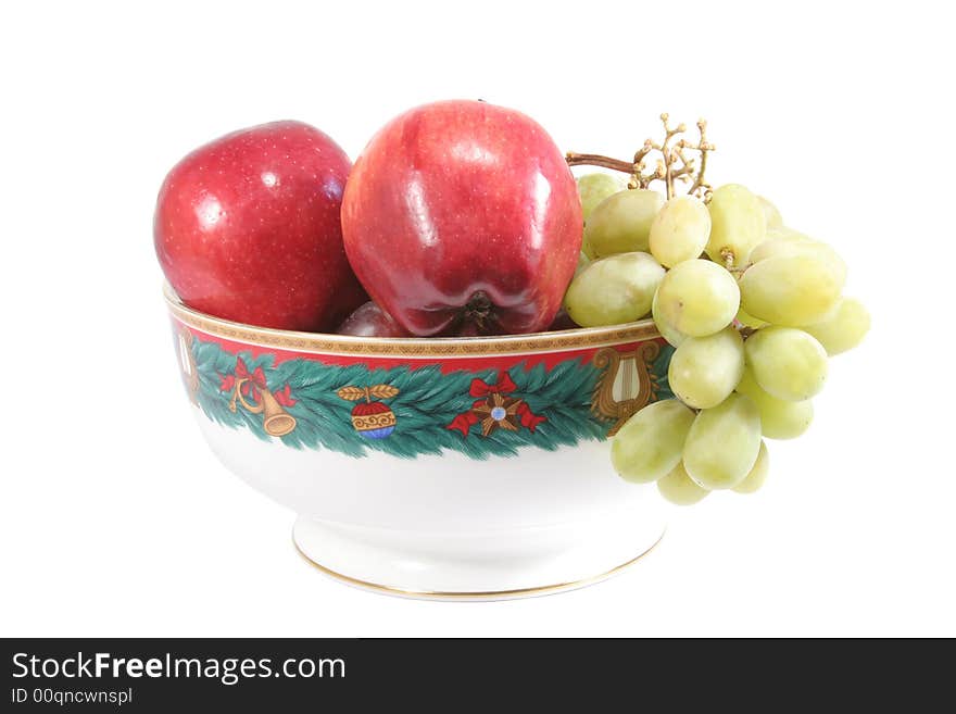 Fruits inside a christmas ornamental bowl. Fruits inside a christmas ornamental bowl