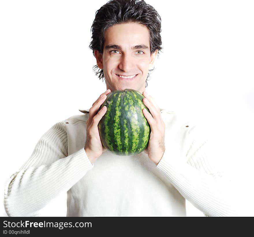 A man is holding fruit in his hands. A man is holding fruit in his hands