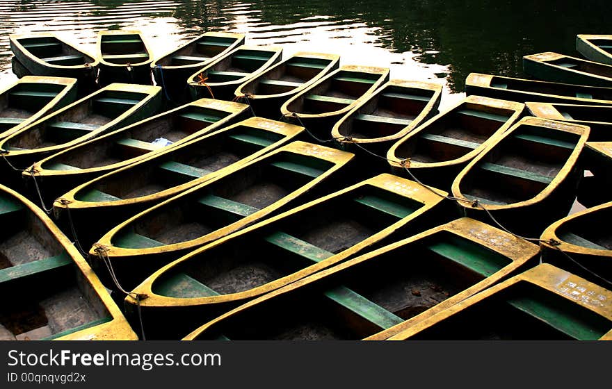 Rowing boats anchoring in a lake berth
