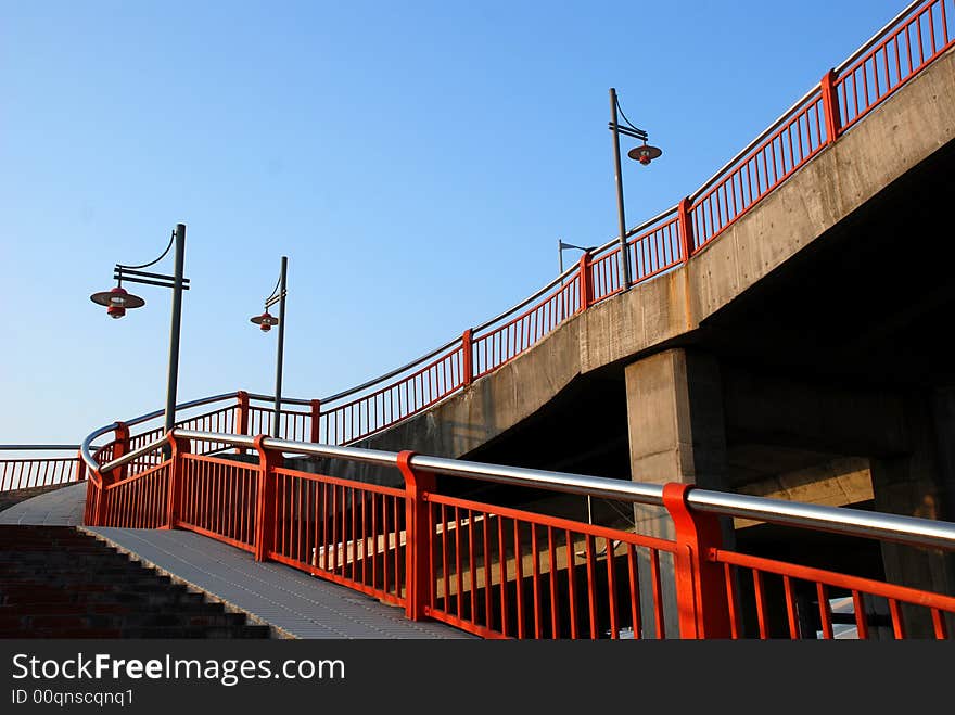 Street lamps,railings and footbridge backgrouded with blue sky in sunny day. Street lamps,railings and footbridge backgrouded with blue sky in sunny day.