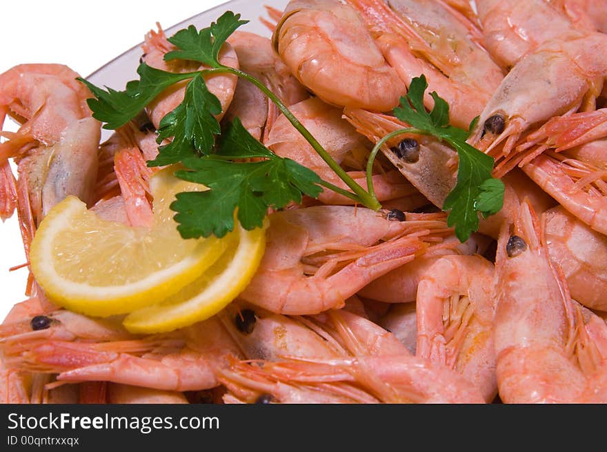 Shrimps with a lemon on white background