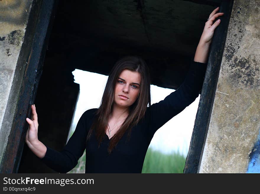 Young girl in the field on the warm winter day in the old ruin. Young girl in the field on the warm winter day in the old ruin