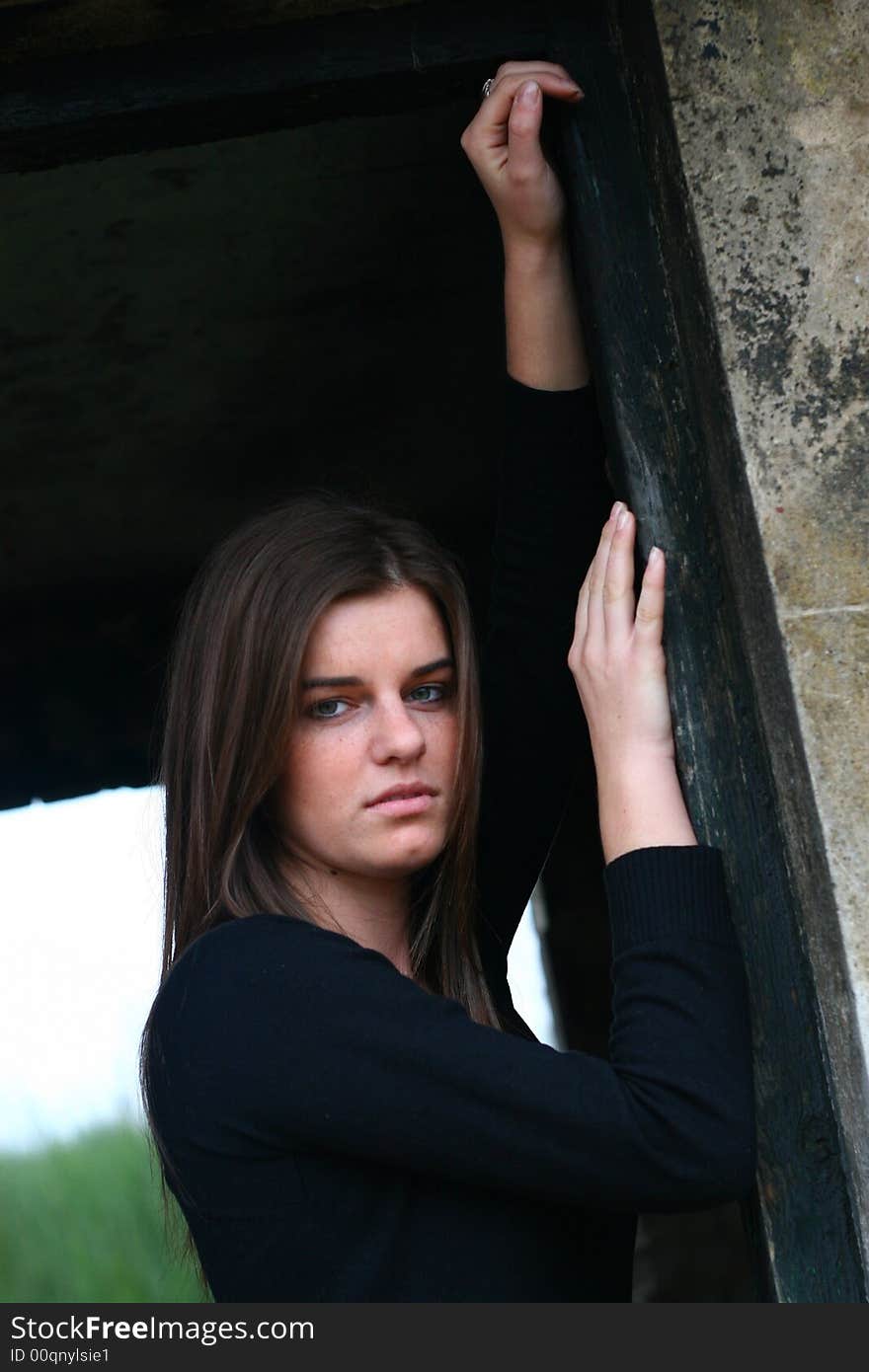 Young girl in the field on the warm winter day in the old ruin. Young girl in the field on the warm winter day in the old ruin