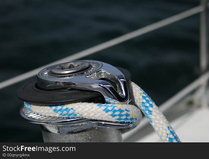 Stainless steel winch and sheet with sea background