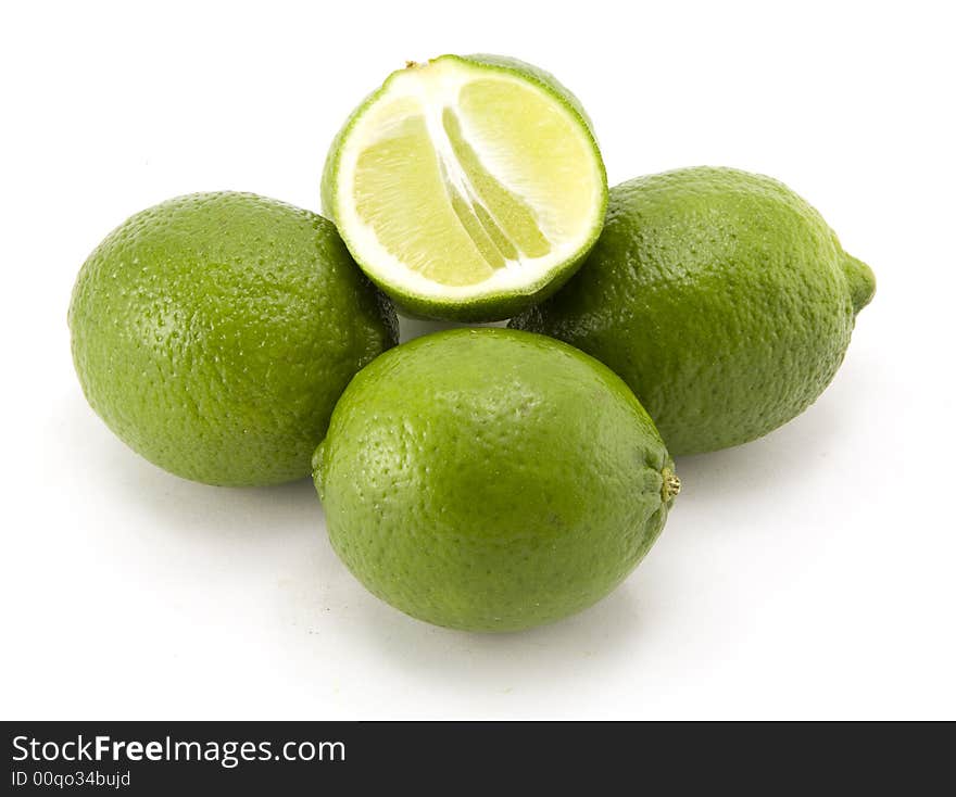 Group of Whole Limes with Halved Lime Isolated on White Background.