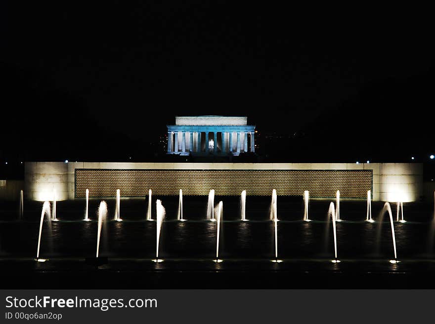 The Lincoln Memorial in behind the fountain of the World War 2 memorial. The Lincoln Memorial in behind the fountain of the World War 2 memorial.