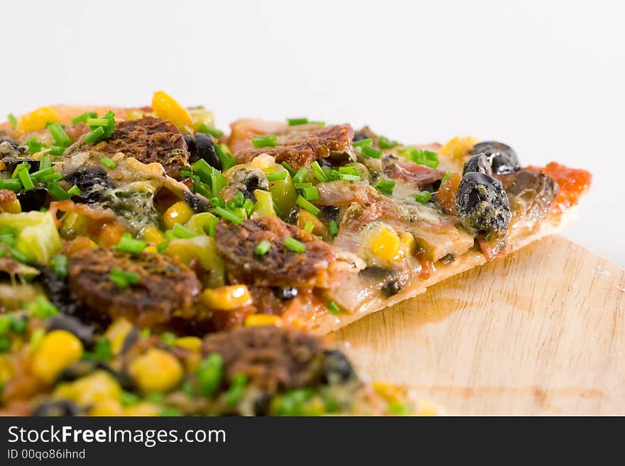 Closeup homemade pizza slices on white background.