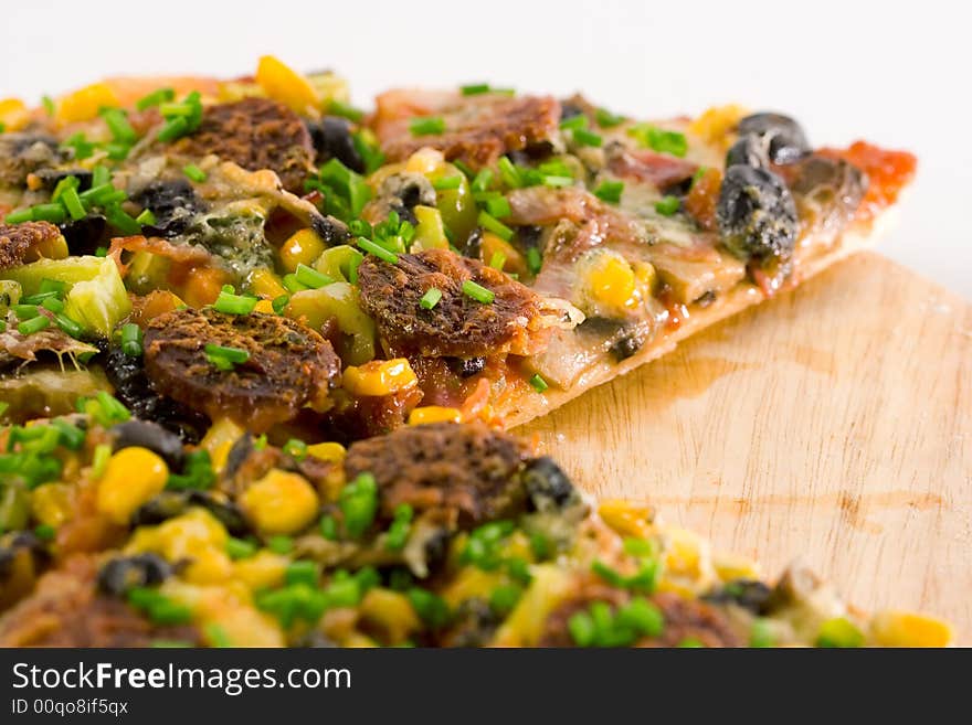 Closeup homemade pizza slices on white background.