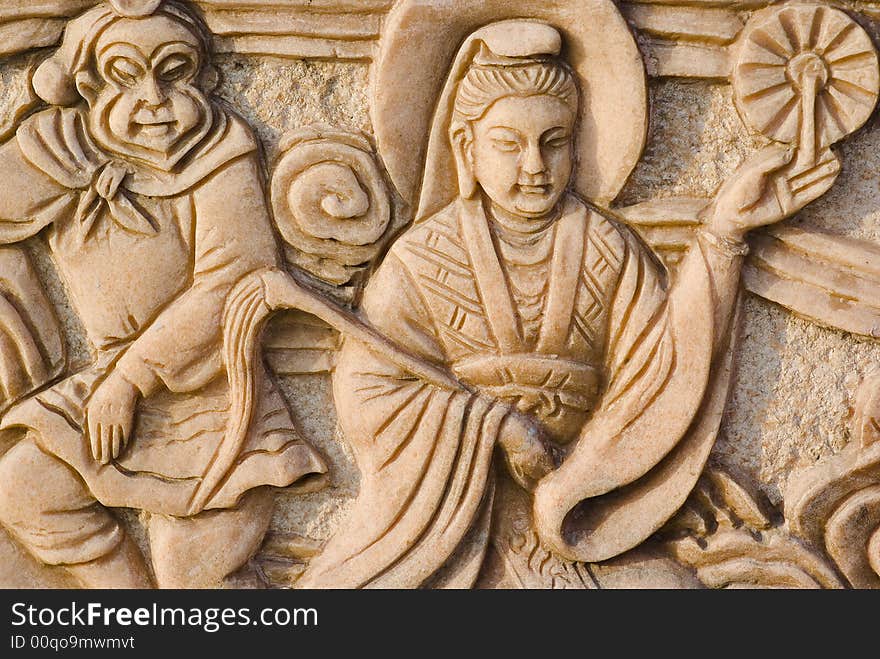 It is a story about buddhism on stone by artificial carving . It is a story about buddhism on stone by artificial carving .