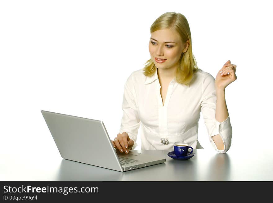 Beautiful girl working in the office, with cup of coffee