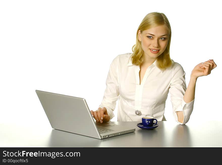 Beautiful girl working in the office, with cup of coffee