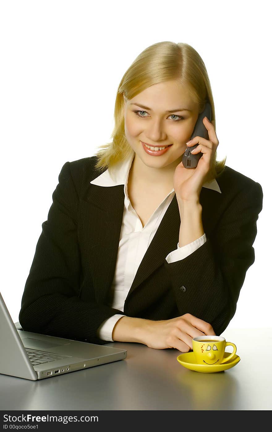 Beautiful girl working in the office, with cup of coffee