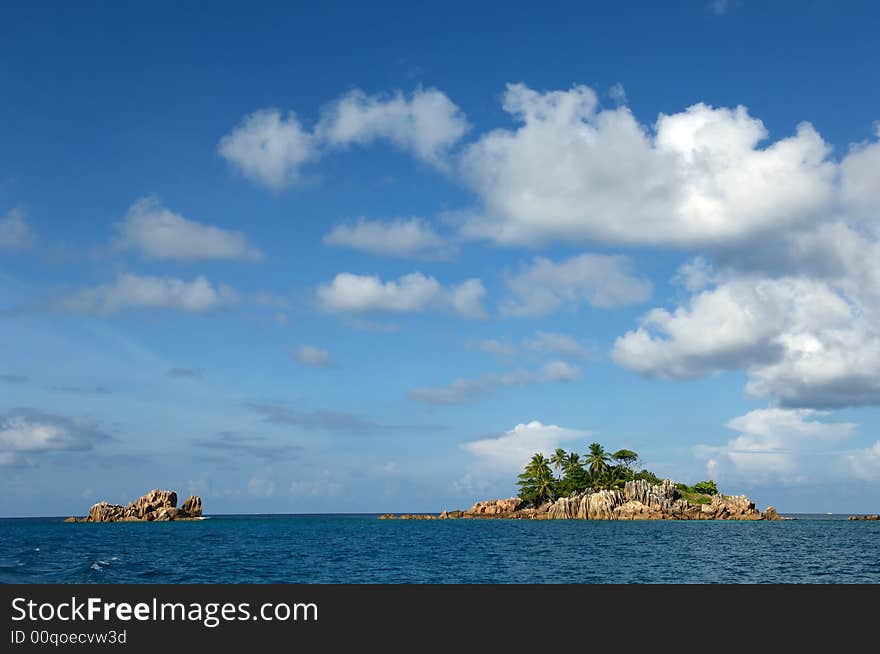 Island at the Indian ocean with coconut palm trees