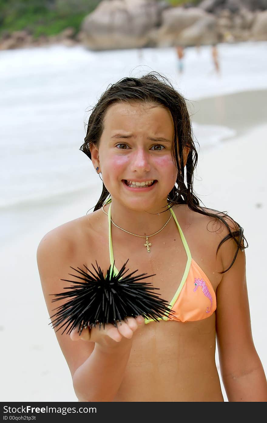 The girl for the first time holds a sea hedgehog