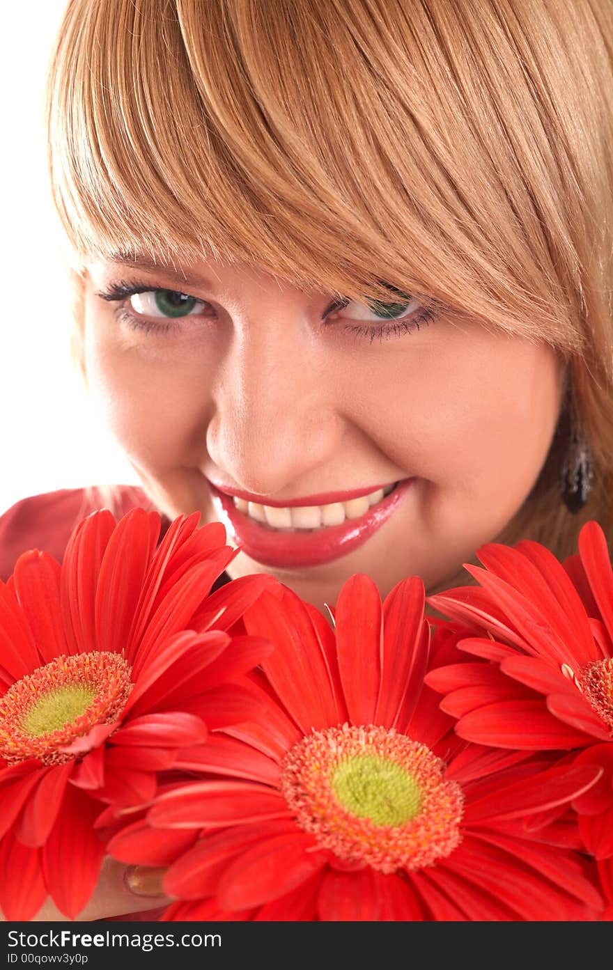 A smiling blonde with red flowers