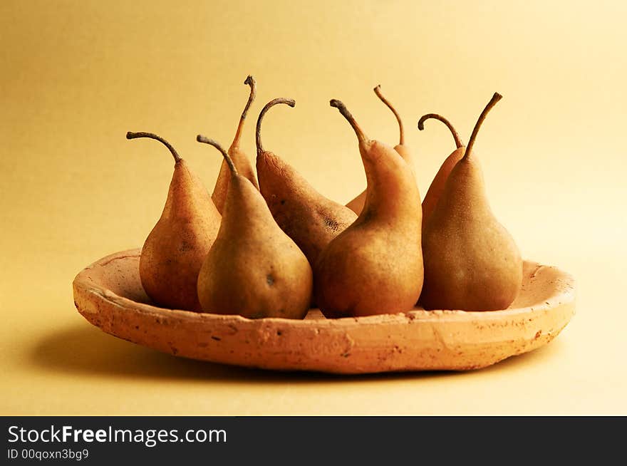 Pears in a plate on a table