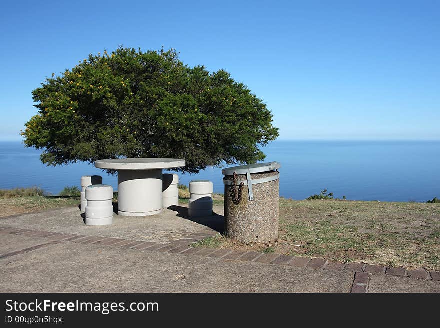 Isolated picnic area with tree overlooking the ocean