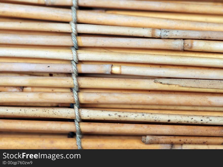 Bamboo background with tied rope