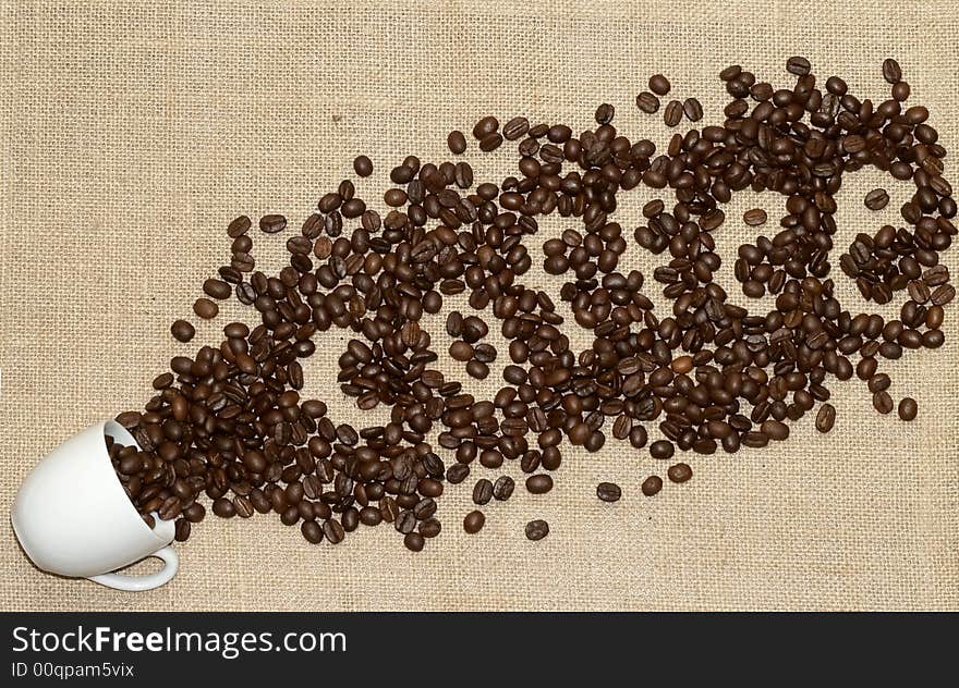 Grains of coffee on a tissue background