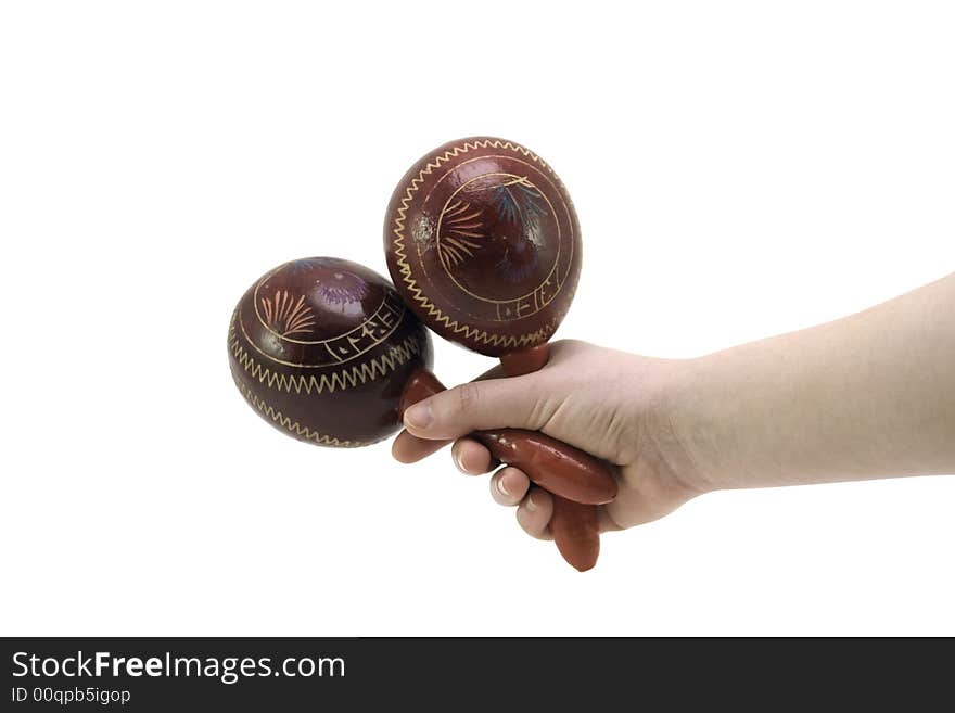 A pair of maracas held by a model against a white background.