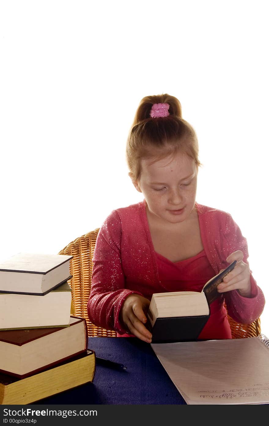 Young girl is reading a lot of  studybooks. Young girl is reading a lot of  studybooks