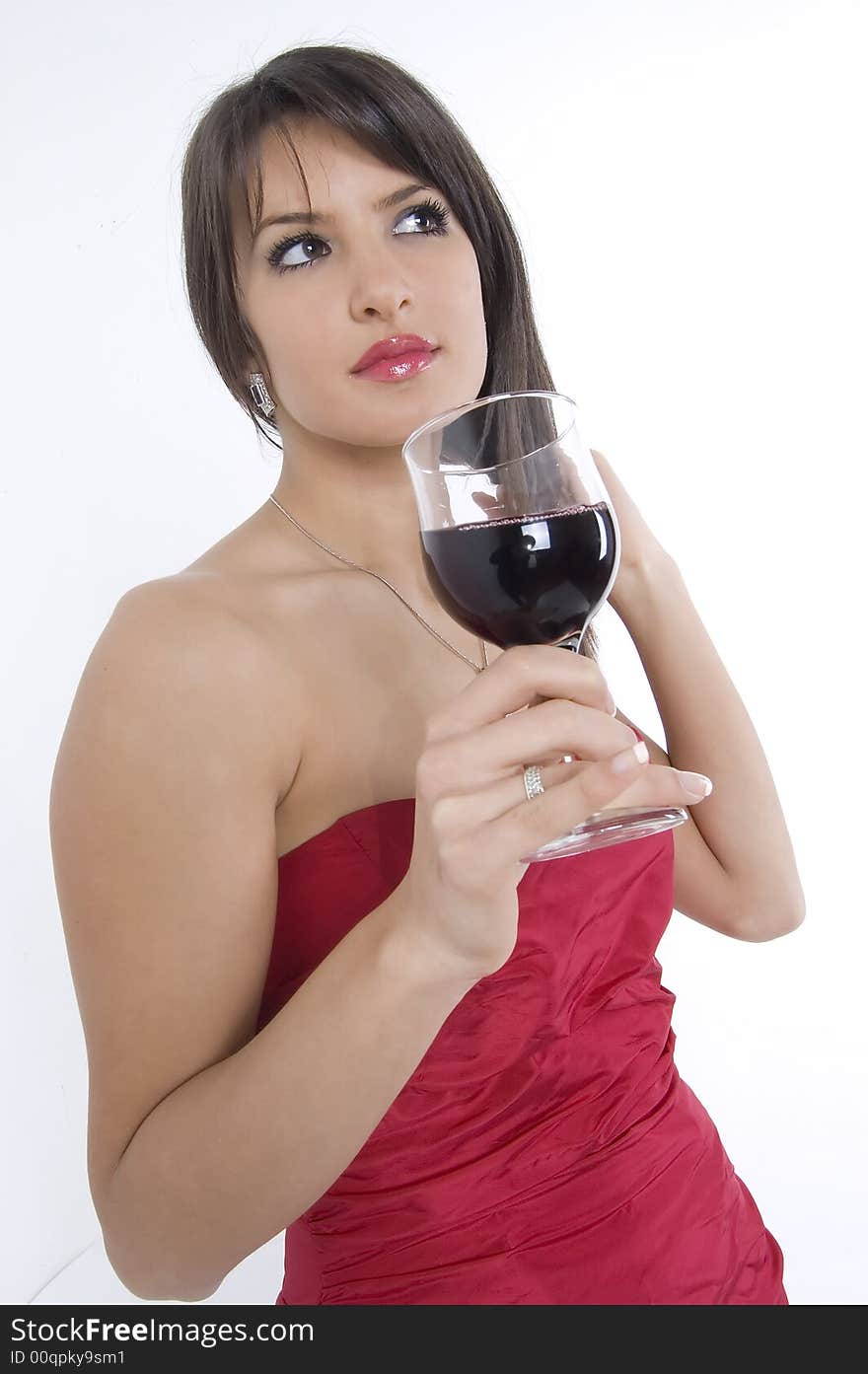 Pretty girl in red dress drinking wine. Pretty girl in red dress drinking wine