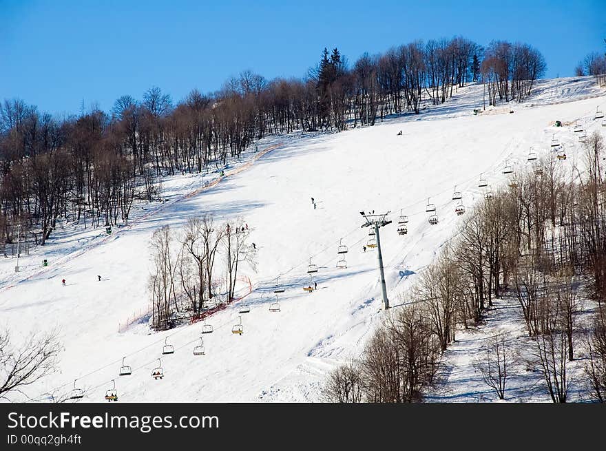 Skiing as popular winter sport. Skiing down the hill near Zakopane.