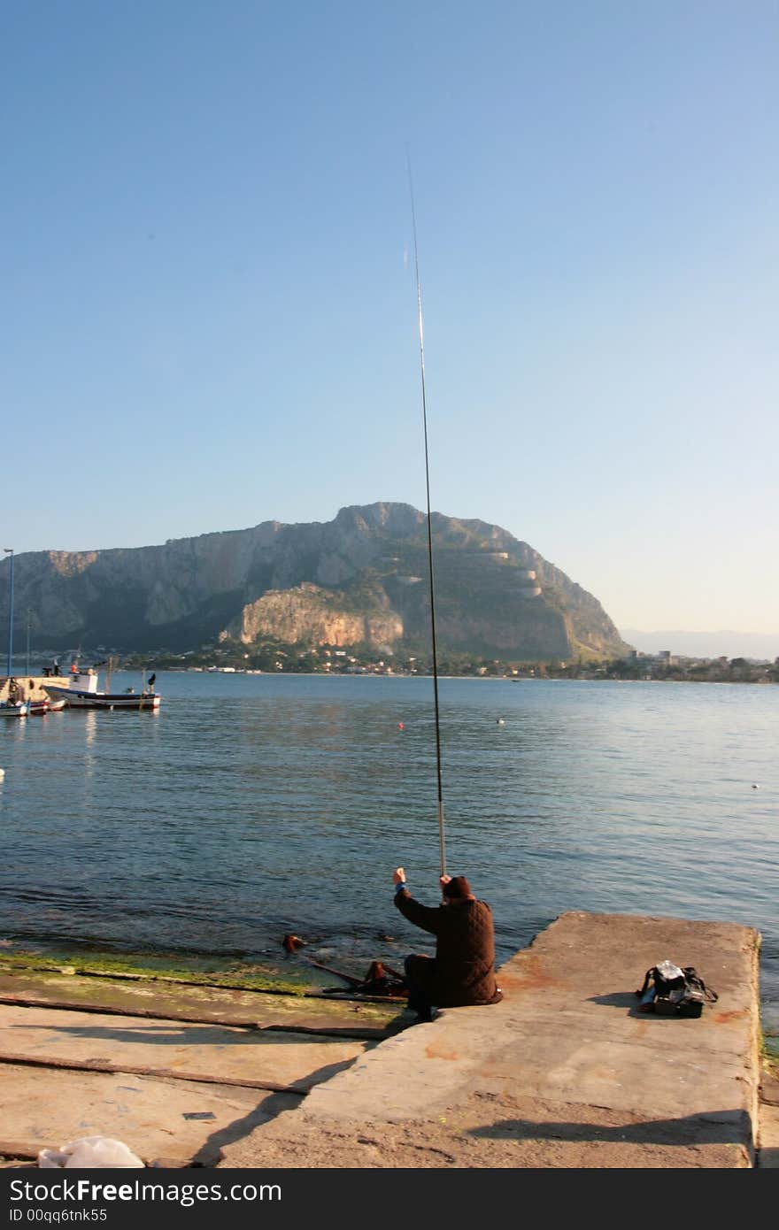 Colorful Sicilian boats on the dock in the port of Mondello, near Palermo. Coast line and beach. Sicily - Italy. Colorful Sicilian boats on the dock in the port of Mondello, near Palermo. Coast line and beach. Sicily - Italy