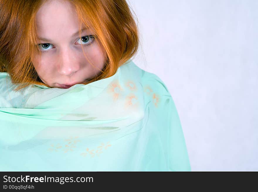 Portrait of  innocent looking young woman with a veil.