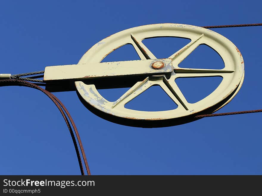 An old ski life cable isolated against a blue sky. An old ski life cable isolated against a blue sky