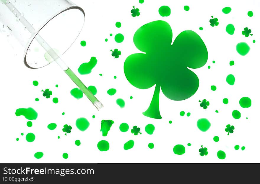 Spilled water glass with green drops shaped like four leaf clovers. Spilled water glass with green drops shaped like four leaf clovers