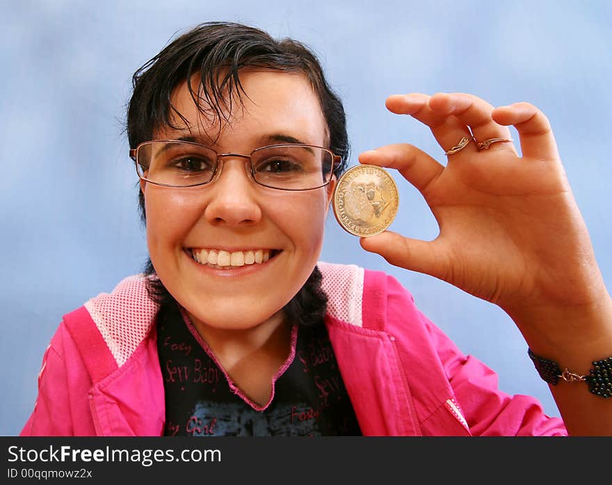 The joyful girl with a coin in a hand . The fish eye.