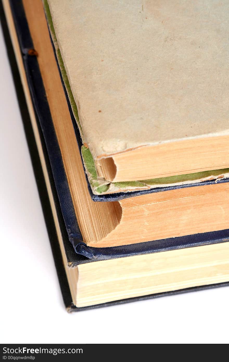 Stack of old books on white background