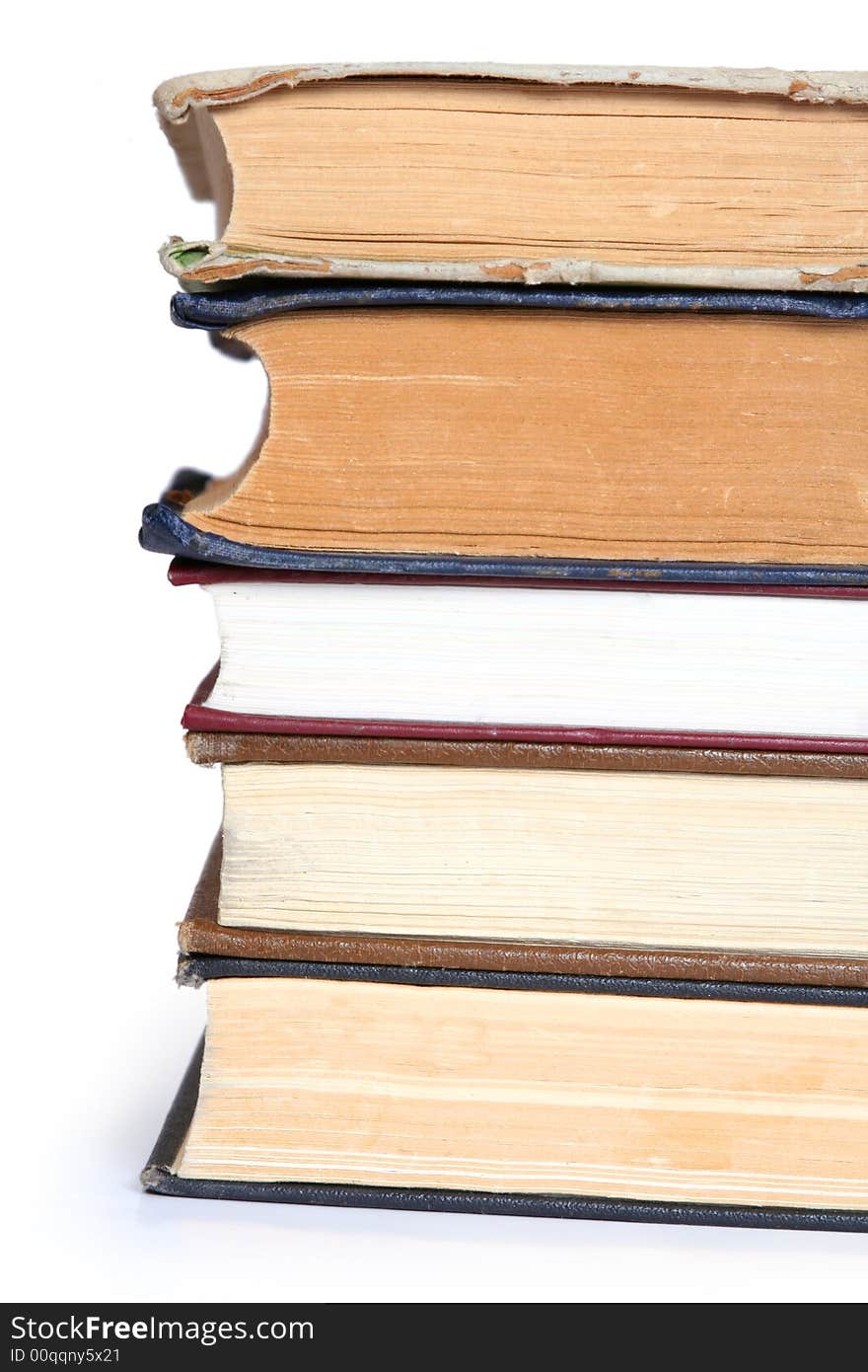 Stack of old books on white background