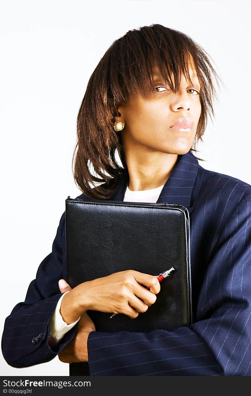 Business woman with portfolio and red pen in hands