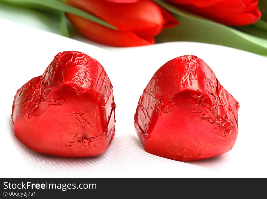 Chocolates for Valentine day and red tulips