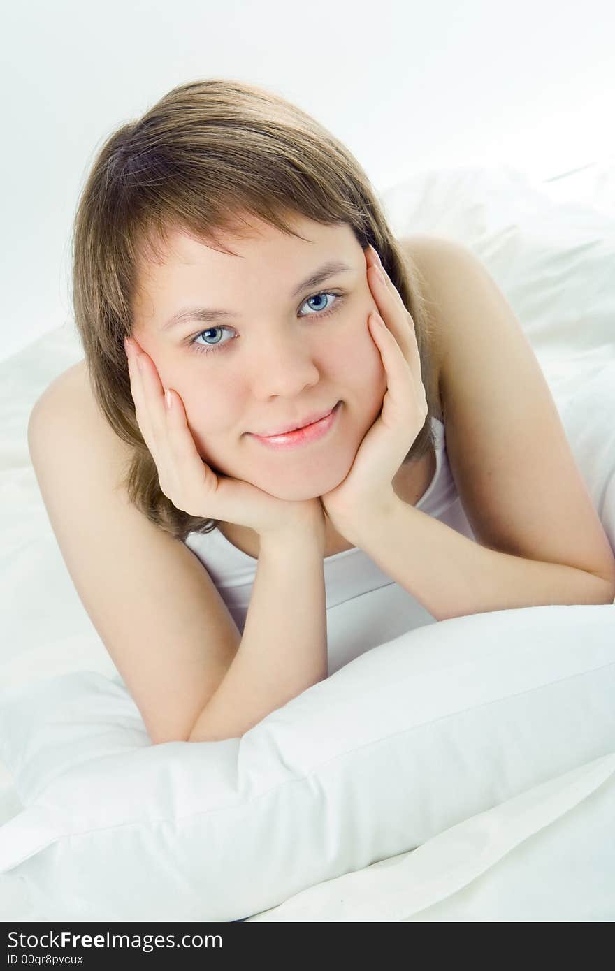 Young woman lie in bed