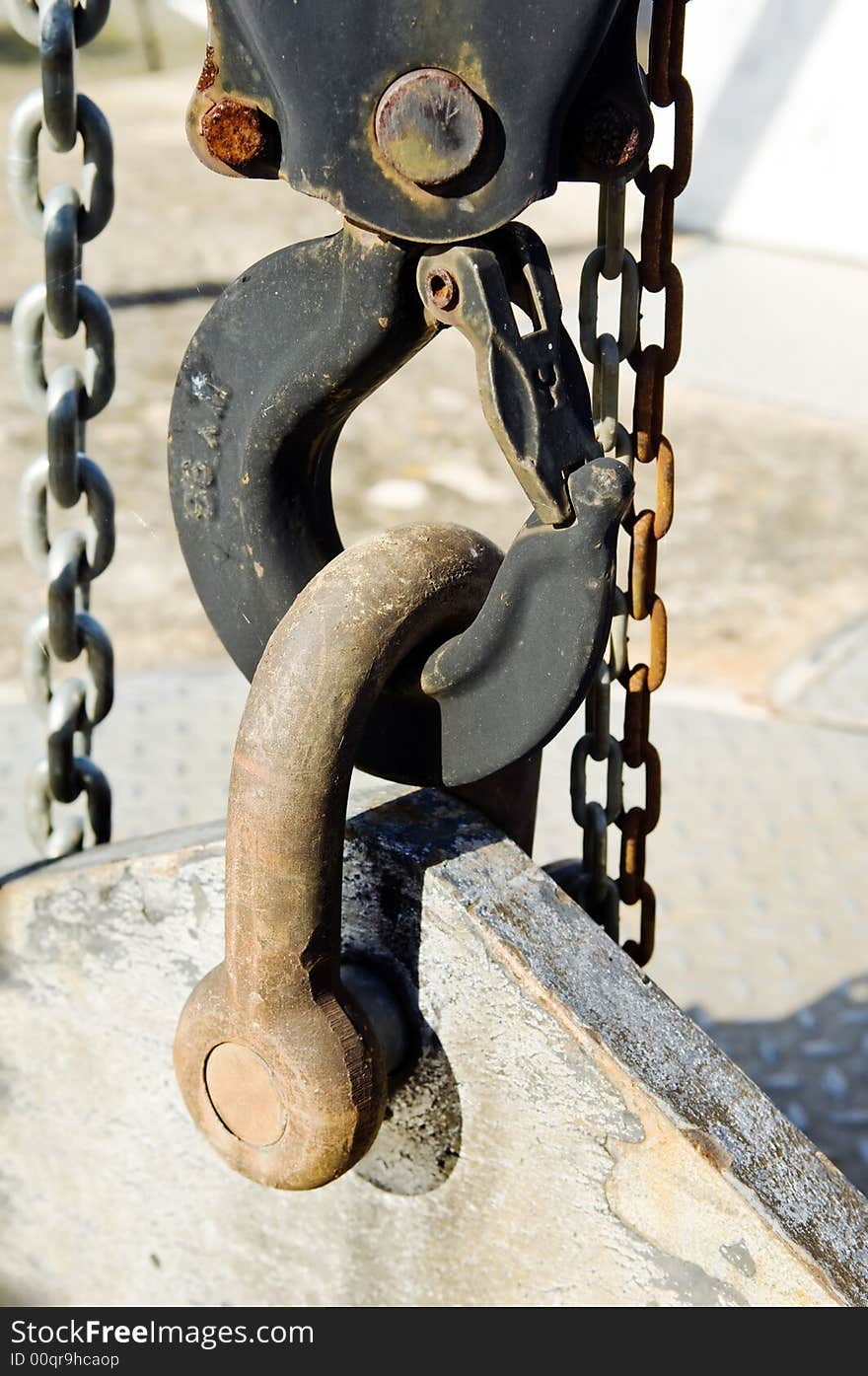 Industrial lifting hook with chains and beam