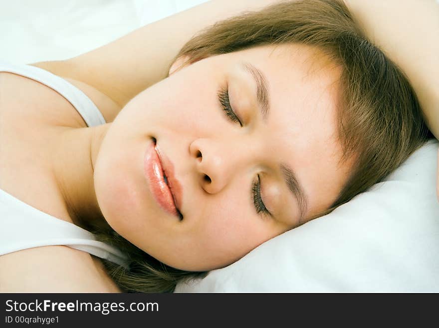 Young woman lie in bed