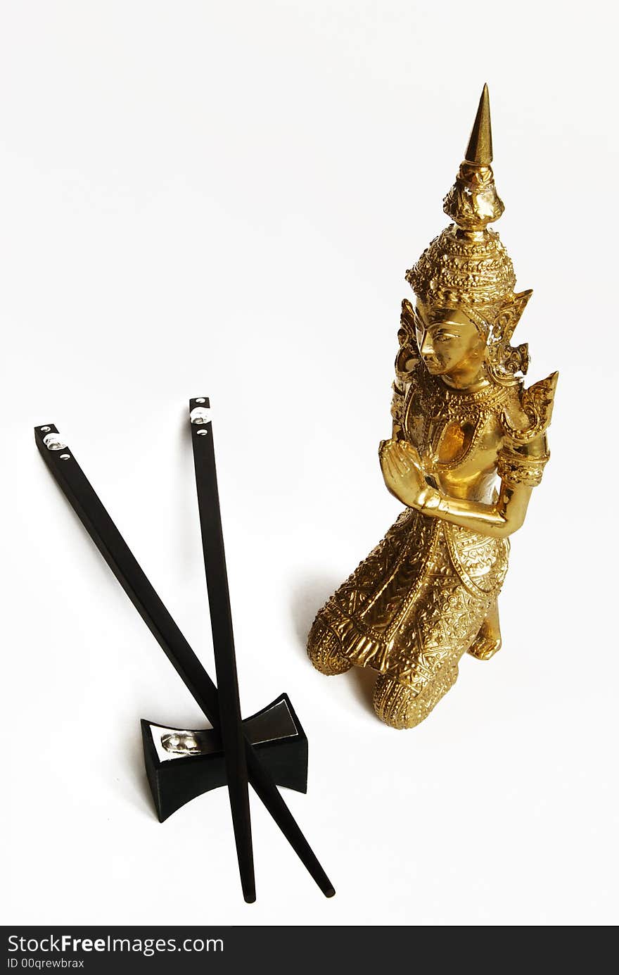 Golden budda and chopsticks