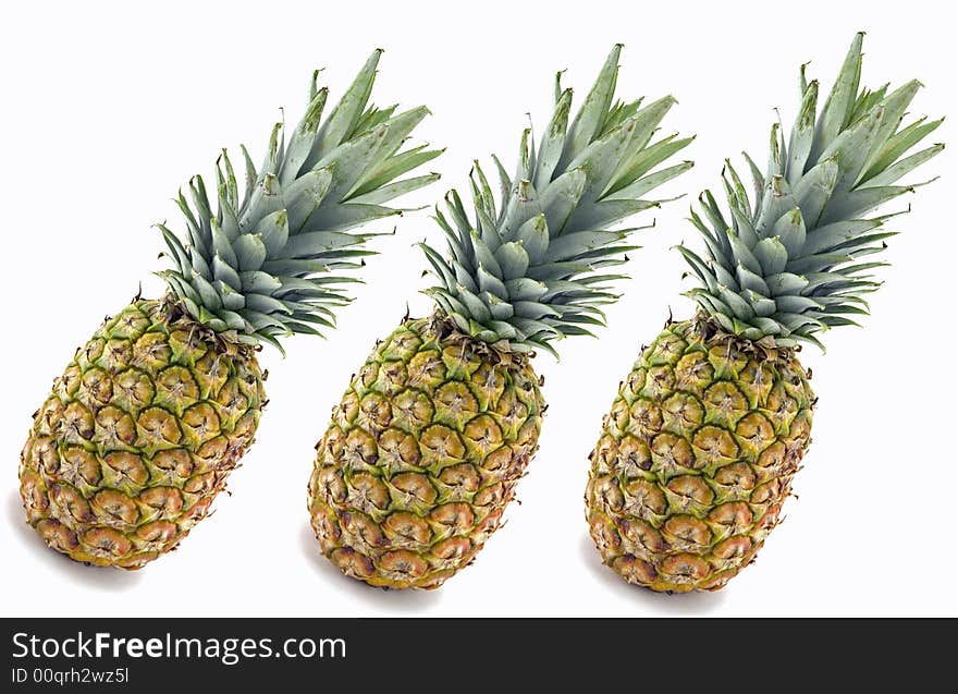 Three Pineapples Isolated on White Background.