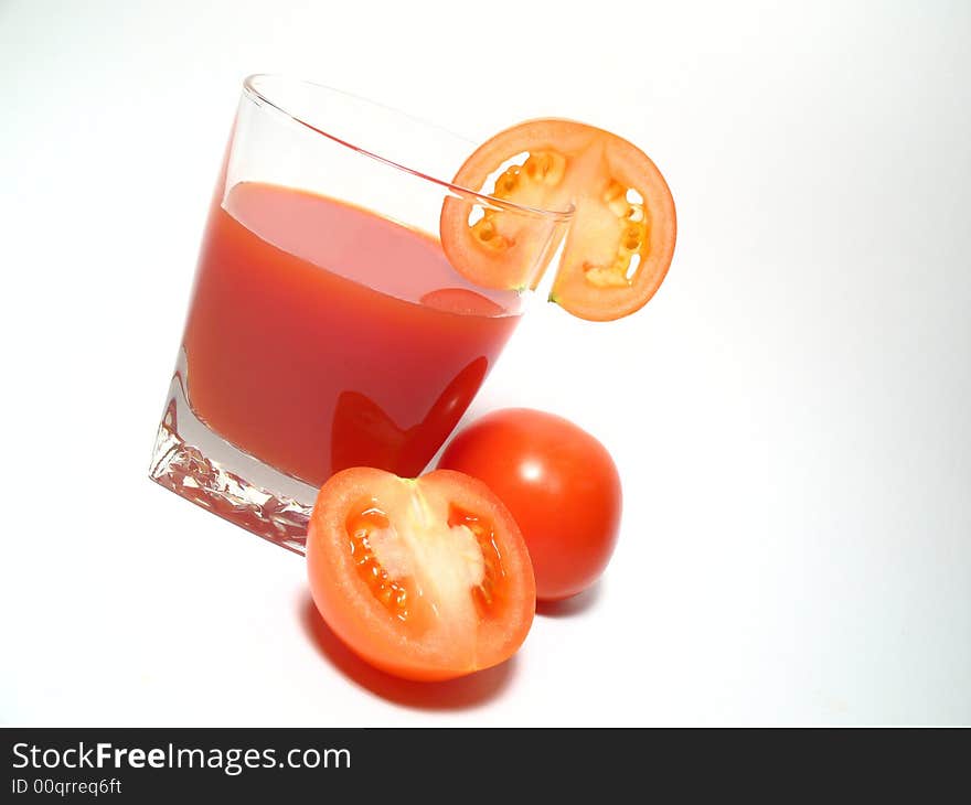 Still life with tomatos juice and tomatos