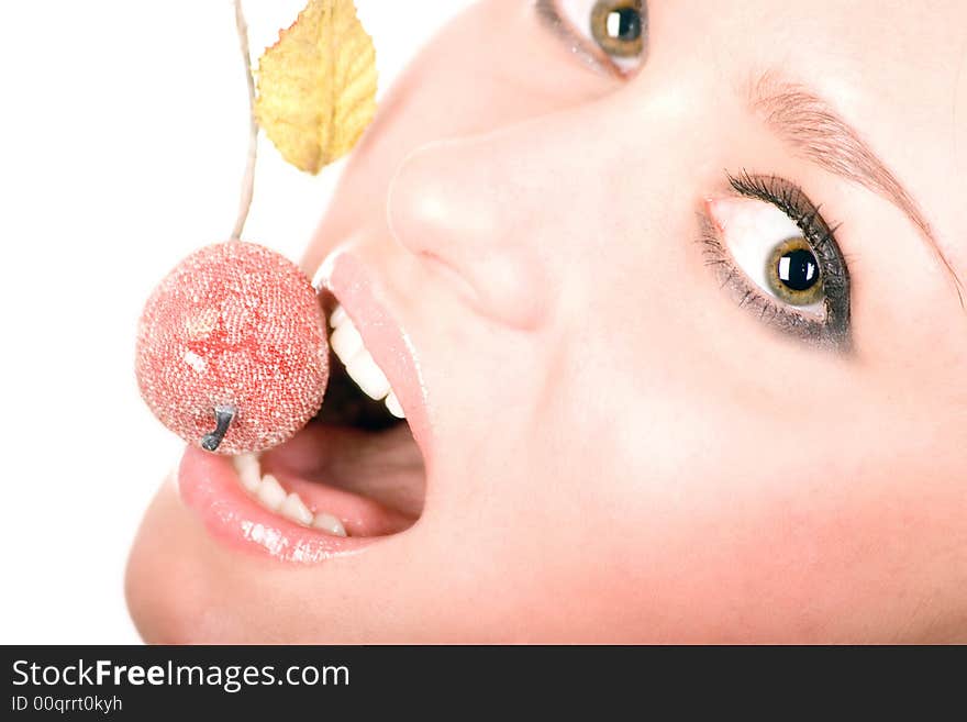 Cute woman eating small apple over white. Cute woman eating small apple over white