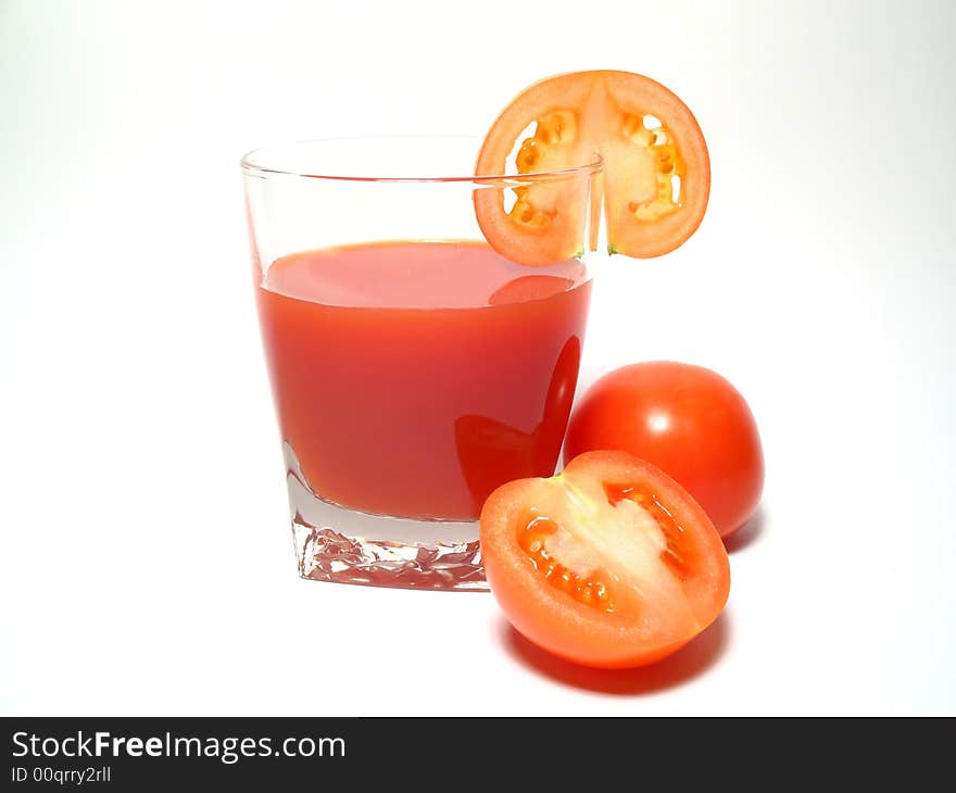 Still life with tomatos juice and tomatos