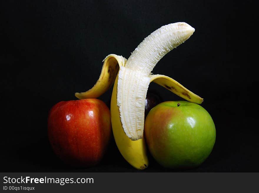 Ripe banana between two apples. Ripe banana between two apples.