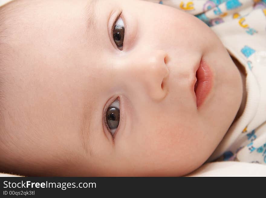 Portrait of the child on the bed. Portrait of the child on the bed