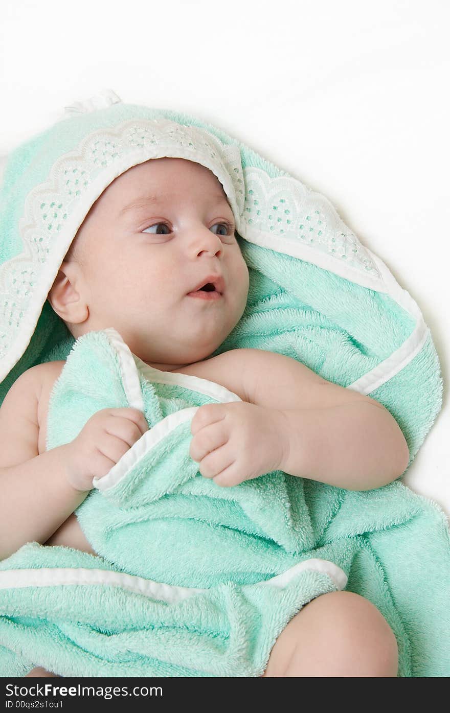 The child after bathing, lays turned in a towel. The child after bathing, lays turned in a towel